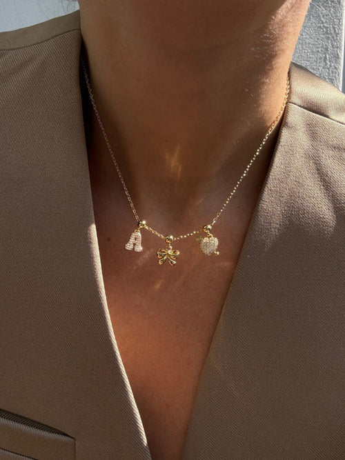 Letter charm - gold WHO IS SHE